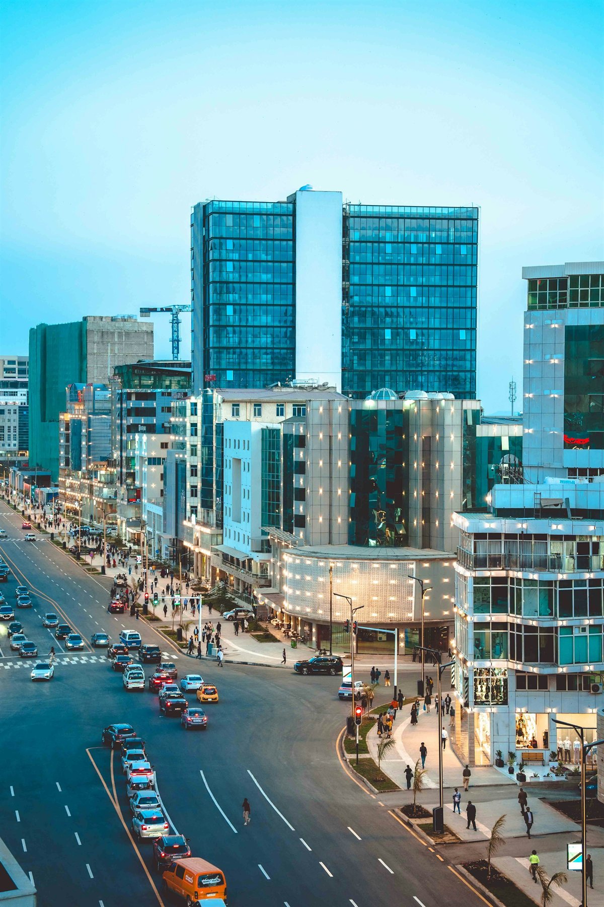 Modern Bole Medhanialem corridor and city streets in Addis Ababa at dusk
