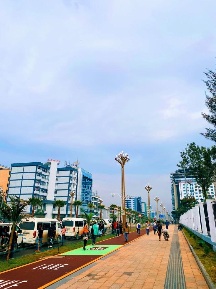 A dedicated red and green bicycle lane beside a pedestrian path in Addis Ababa